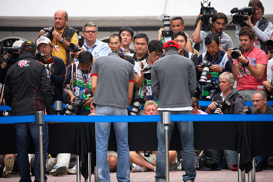 Drivers are called in for hand prints, the international media logs the photoshoot