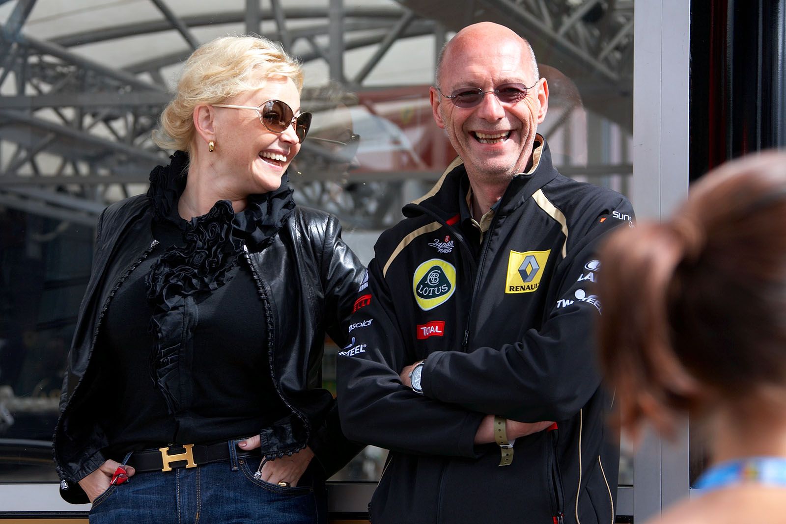 Petrov's manager Oksana Kozachenko rejoices the rare sunshine in front of the Renault motorhome with a VIP