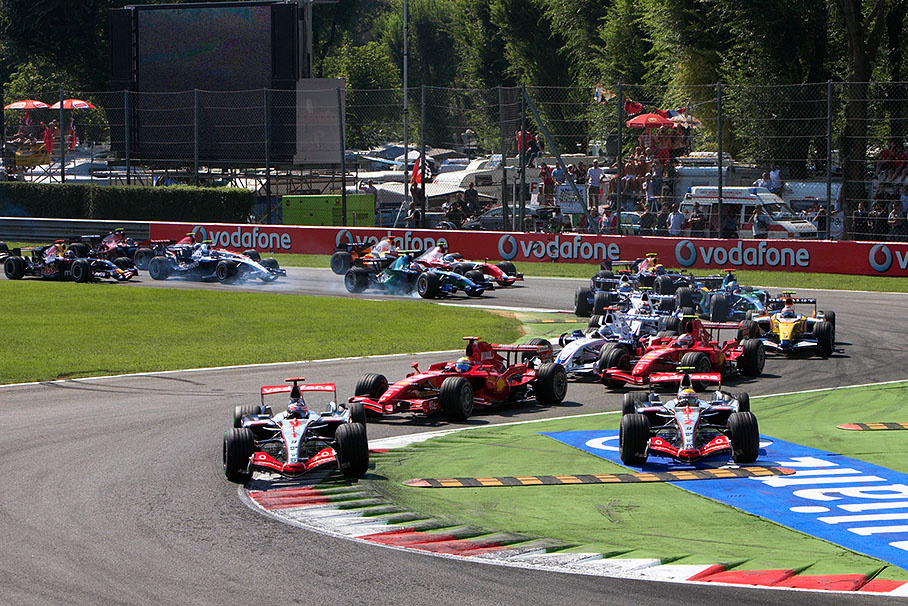 Start field gushes through first chicane, Hamilton misses the apex of second part