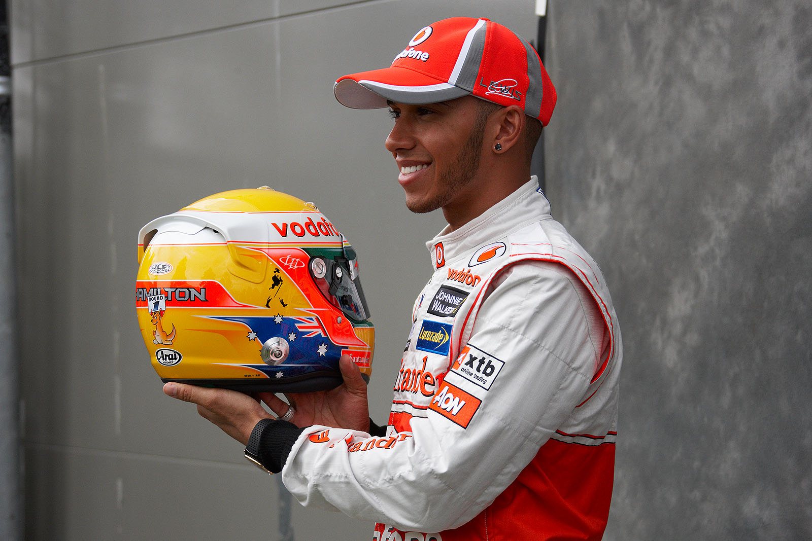 McLarens Lewis Hamilton presents his helmet to the press at the drivers presentation, drawing the attention to the little comic kangaroo which holds a sign for round one of the fresh F1 season