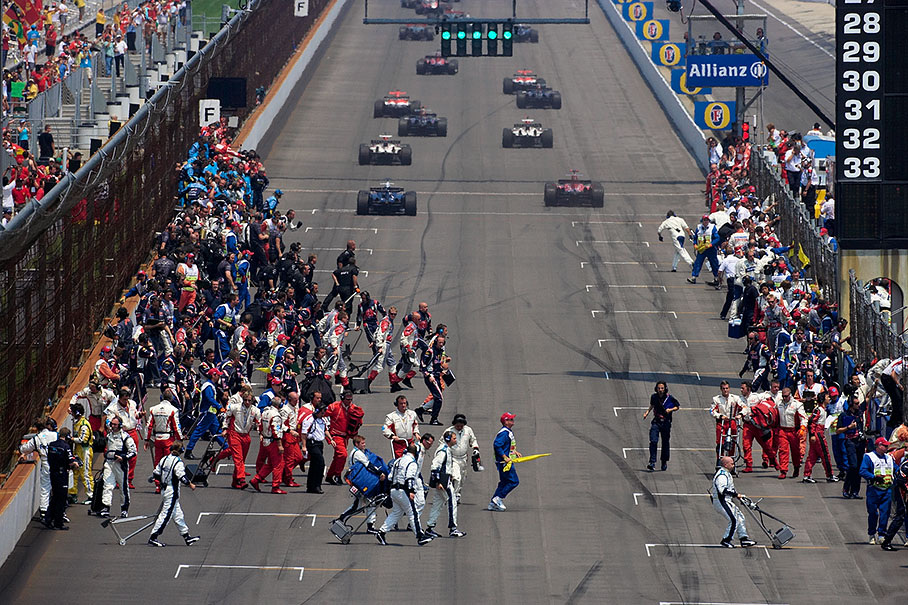 Teams crossing track to their pits