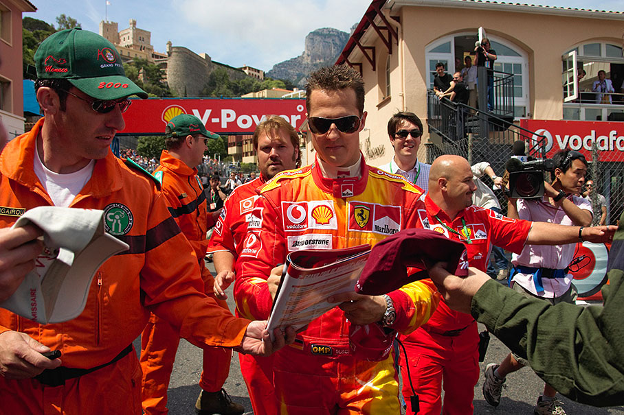 No, not a marshal with a defect washing machine - it is Michael Schumacher on his way to paddock