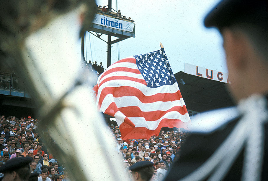The star-spangled banner waves above the fans at the national anthem