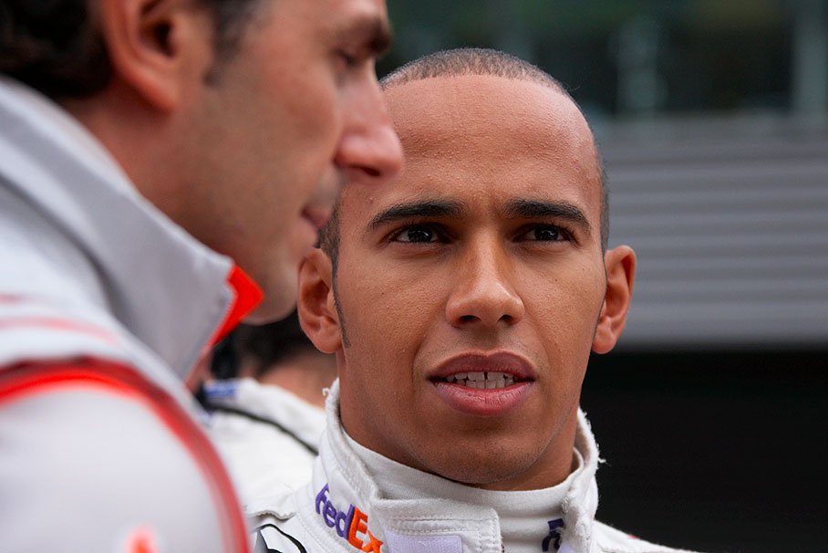 Lewis Hamilton speaks with McLaren test driver Pedro de la Rosa