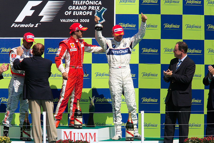 Third placed Kubica celebrates on podium