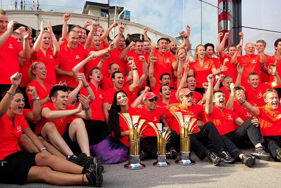 The McLaren team celebrates the one-two victory after the Turkish GP
