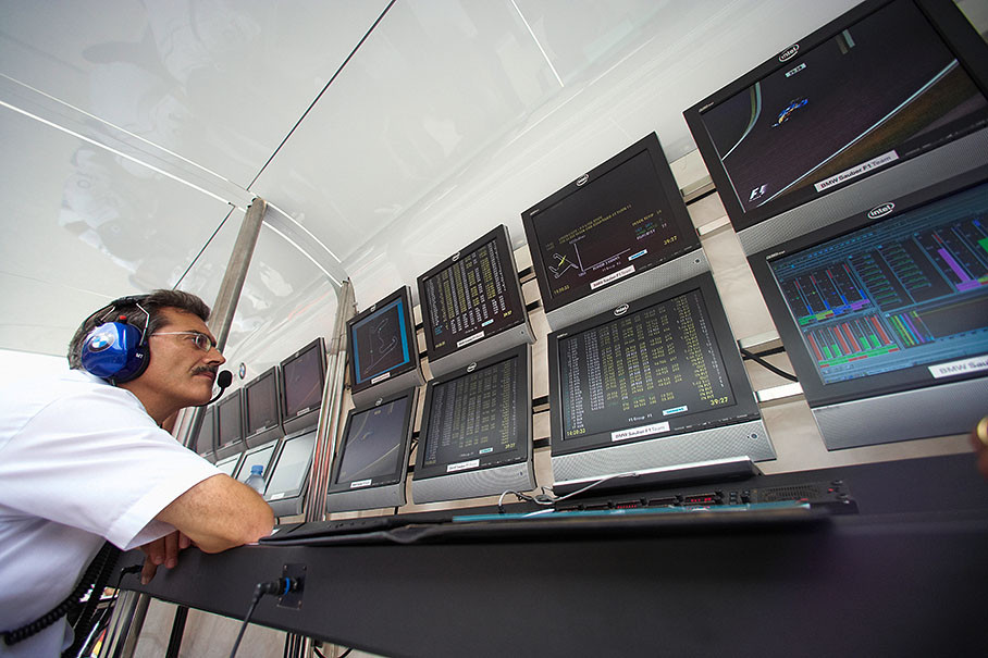 BMW Motorsport director Dr. Mario Theissen watching the screens at his pit wall command center