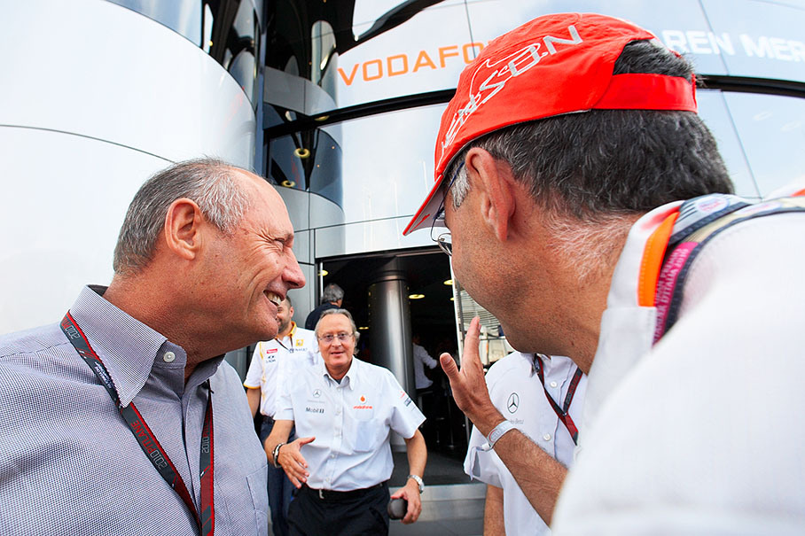 Ron Dennis waits for Mansour Ojjeh in front of the McLaren motorhome