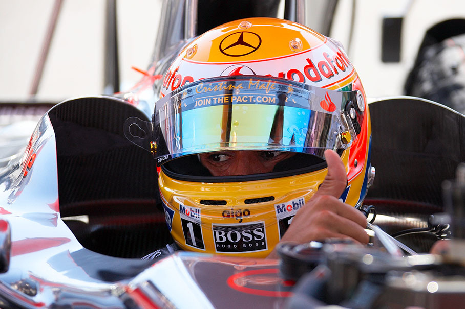 Lewis Hamilton arrives in the McLaren Mercedes car on his pole position
