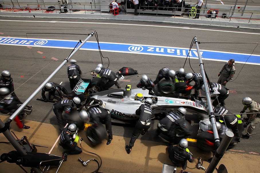 Nico Rosberg performs a pit stop at Mercedes pits