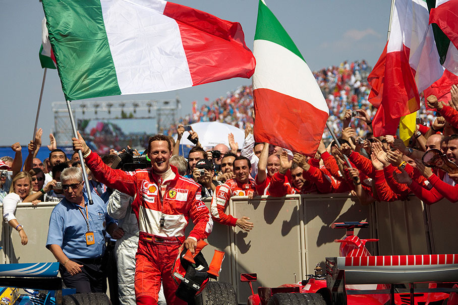 Race winner Michael Schumacher waving the italian "Tricolore" flag