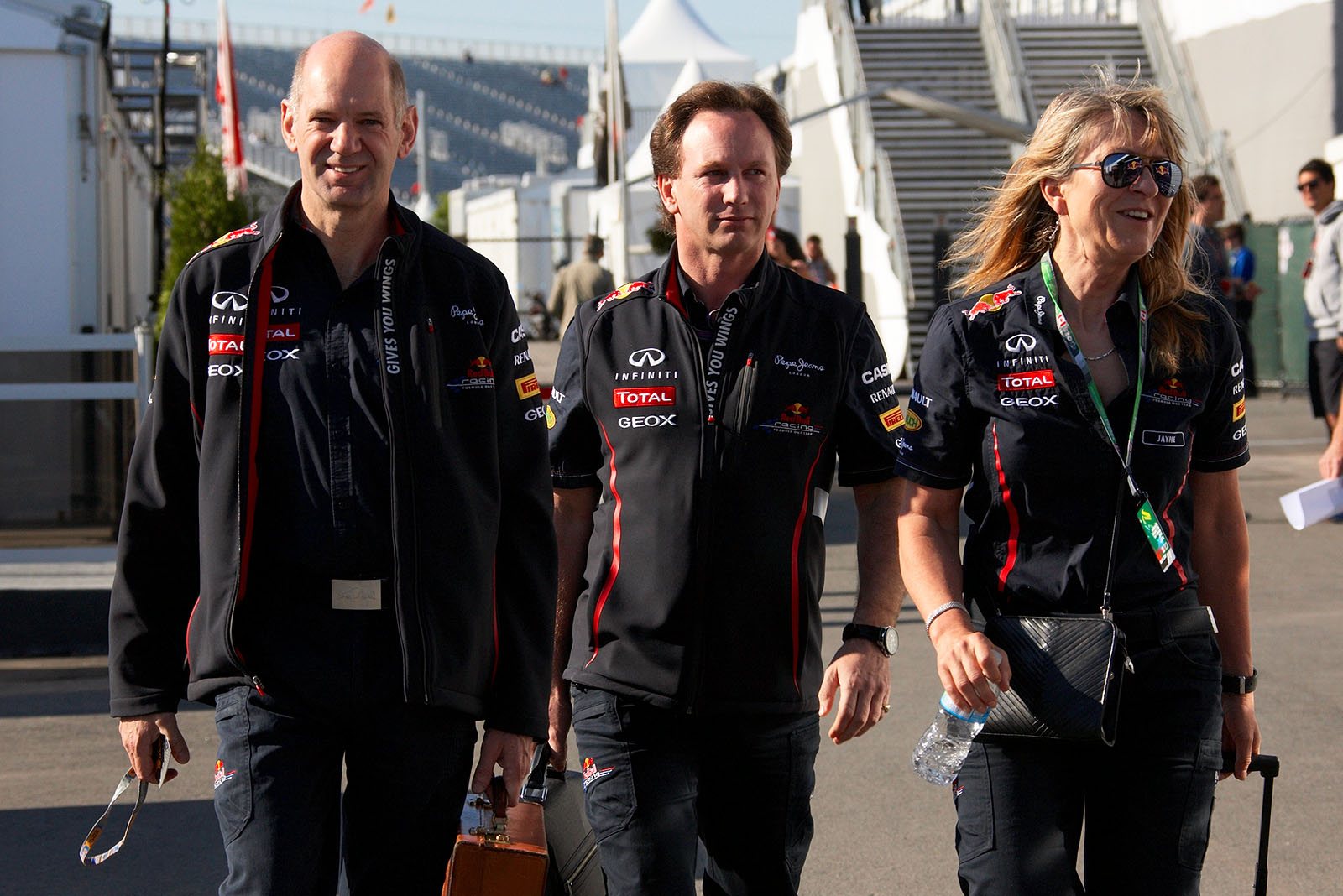 RBR team boss Christian Horner walks with his technical director Adrian Newey and Jane Poole
