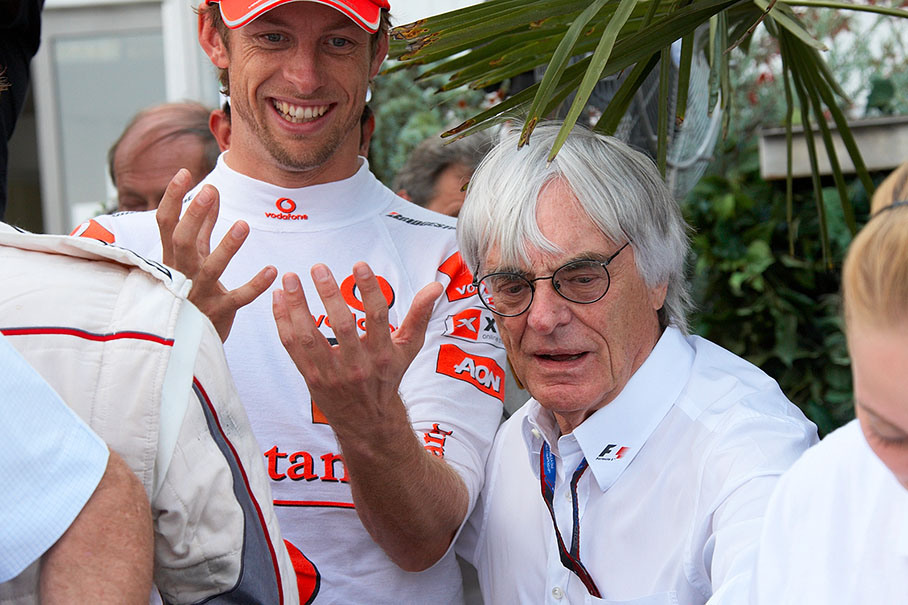 Jenson Button and Bernie Ecclestone wait for a piece of the cream pie