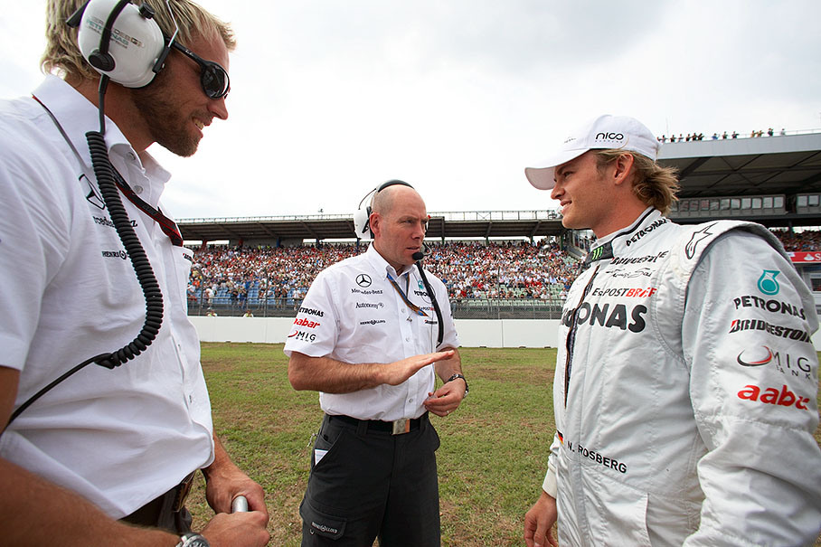 Nico Rosberg on the grid with his physio and Mercedes race engineer Jock Clear