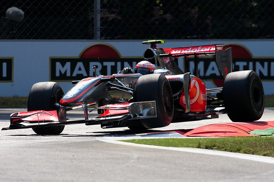 Heikki Kovalainen jumps with the McLaren Mercedes car over the first curbs of Variante Della Roggia