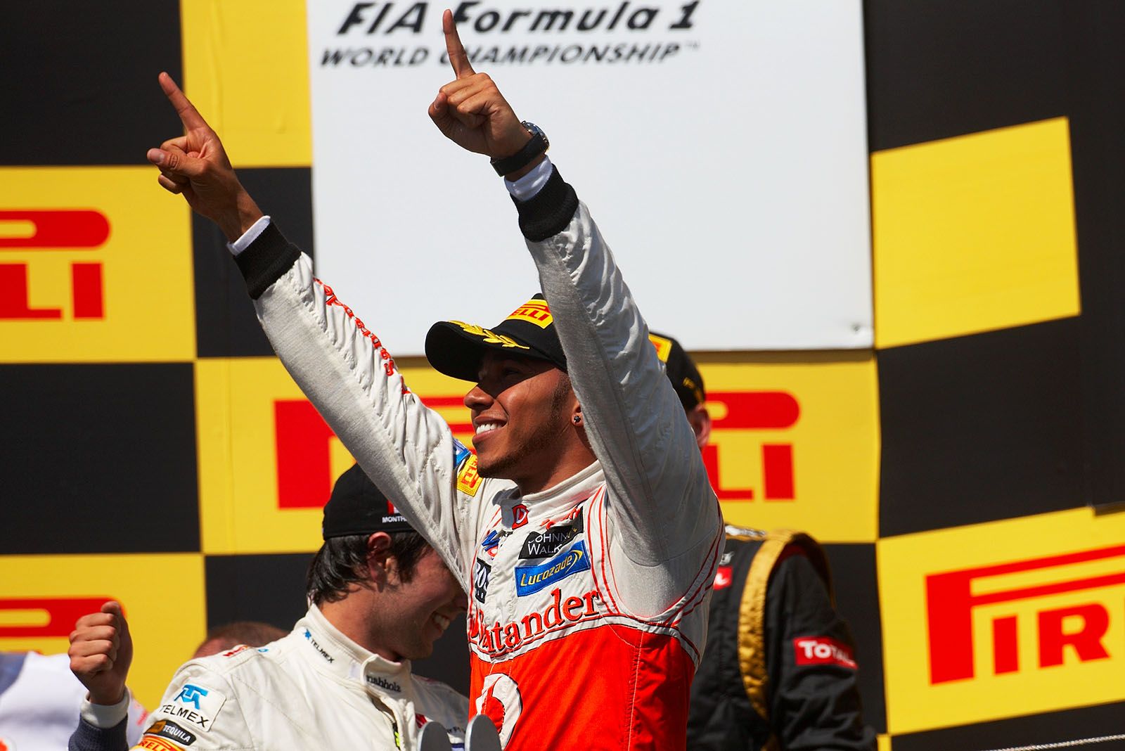 Race winner Lewis Hamilton of McLaren Mercedes celebrates on the podium