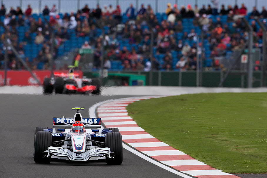 BMW Sauber's Robert Kubica in front of Hamilton