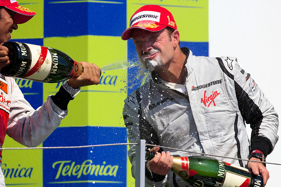 Race winner Rubens Barrichello enjoys a dash of champagne