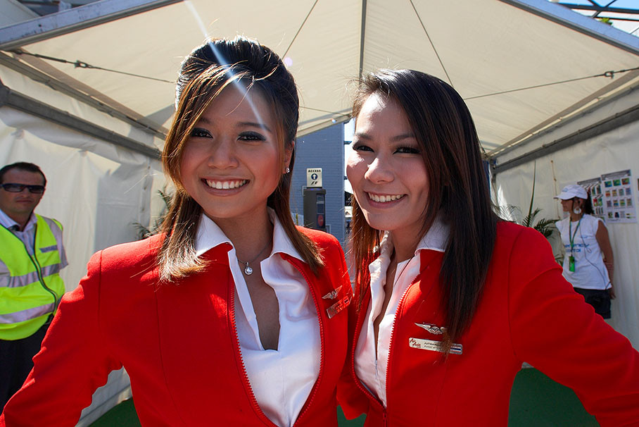 Tony Fernandes' Air Asia stewardesses visit the paddock