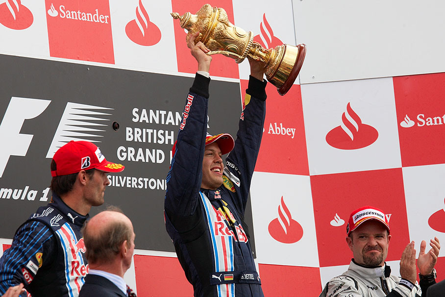 Race winner Sebastian Vettel shakes his golden trophy
