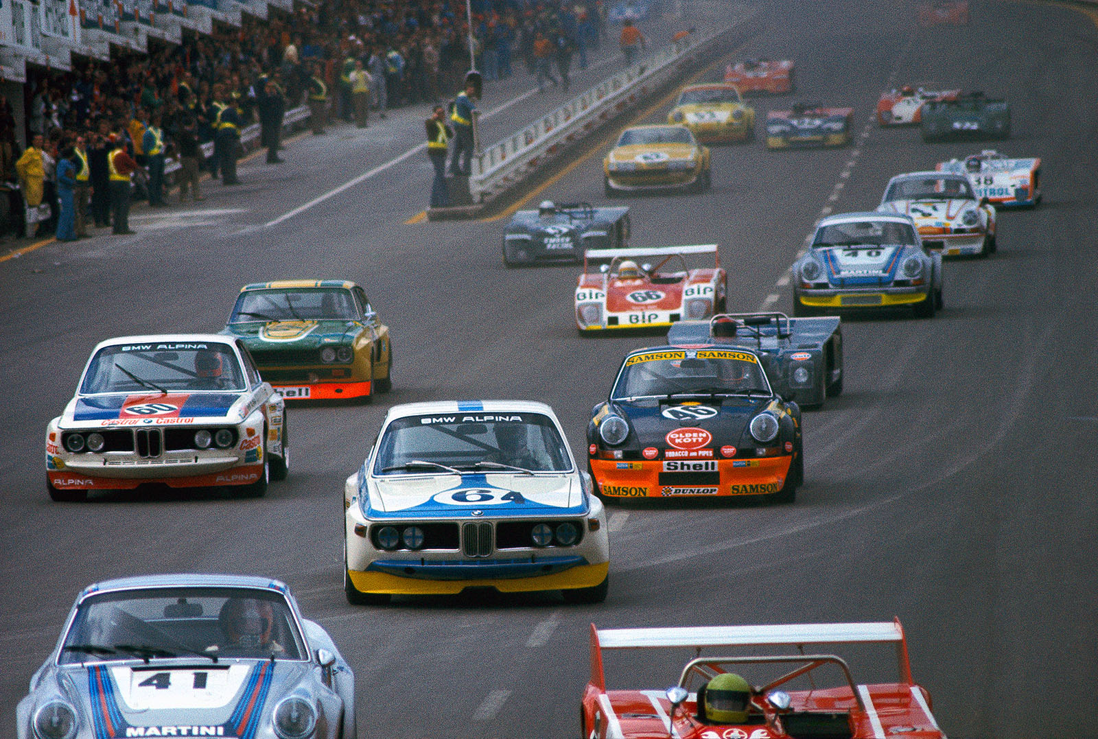 Clemens Schickentanz (D) and John Fitzpatrick (GB) on the Kremer Porsche Carrera RSR 911 #360 0885 (starting number #46), entered by Oldenkott Tobacco, do not finish the 1973 1000km Spa but become fourth placed in the GT classement. No. 64 is the BMW of Hans-Joachim Stuck (D), next to him Niki Lauda (A), also on BMW.