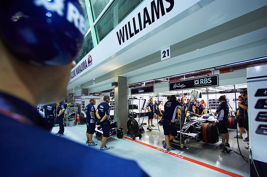 Rosberg and his car are being prepared inside Williams pits