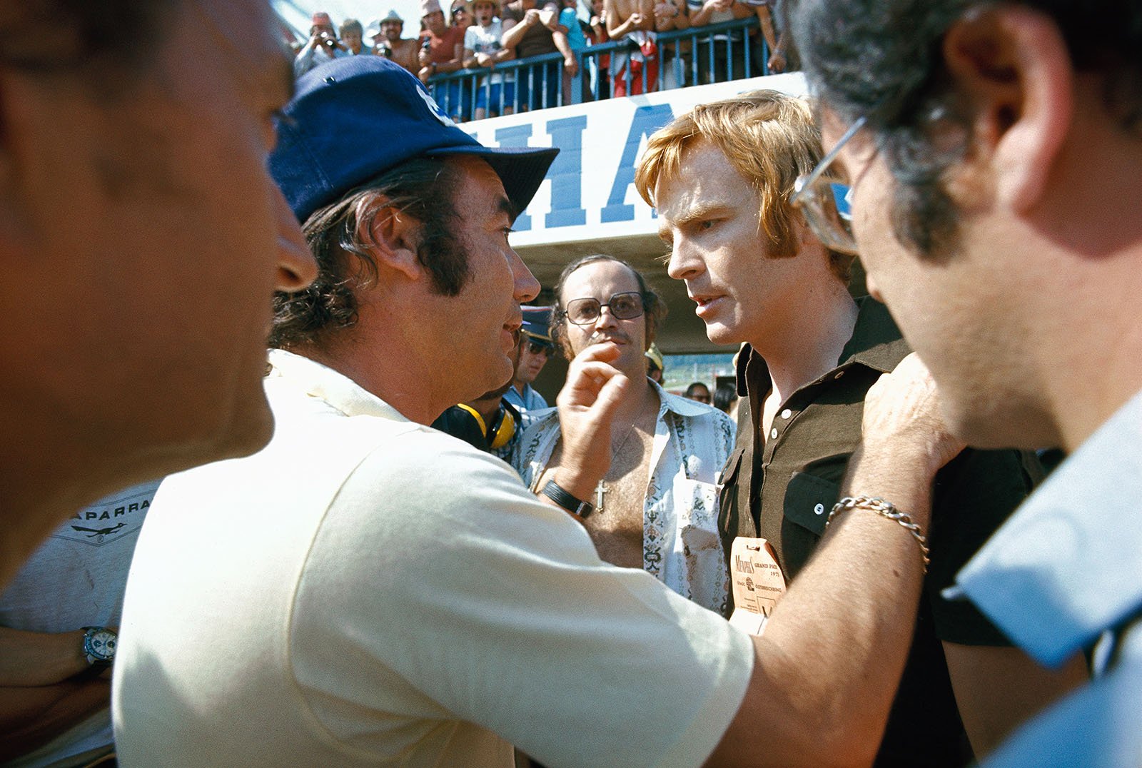 A strike of the photographers in the pitlane kept the drivers away from their cars and IRPA president Bernard Cahier explains the situation to March boss Max Mosley, Austrian Grand Prix, Zeltweg, 1973