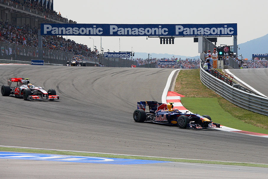 Mark Webber, Red Bull Racing, leads Hamilton and team mate Vettel after a few laps