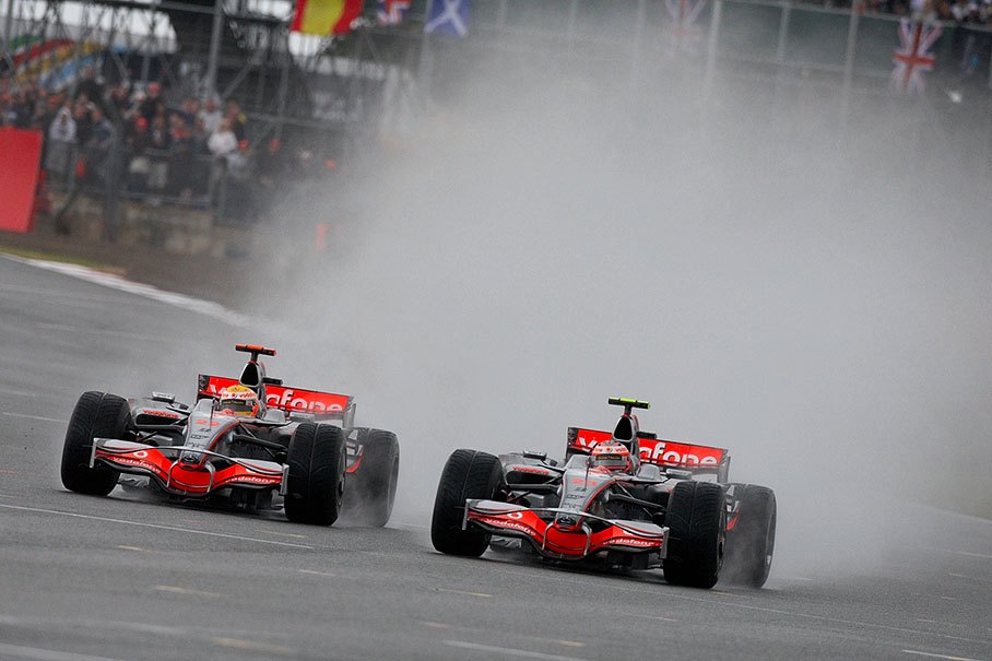 Hamilton nearly overtakes team-mate Kovalainen under loud cheerings from raging fans
