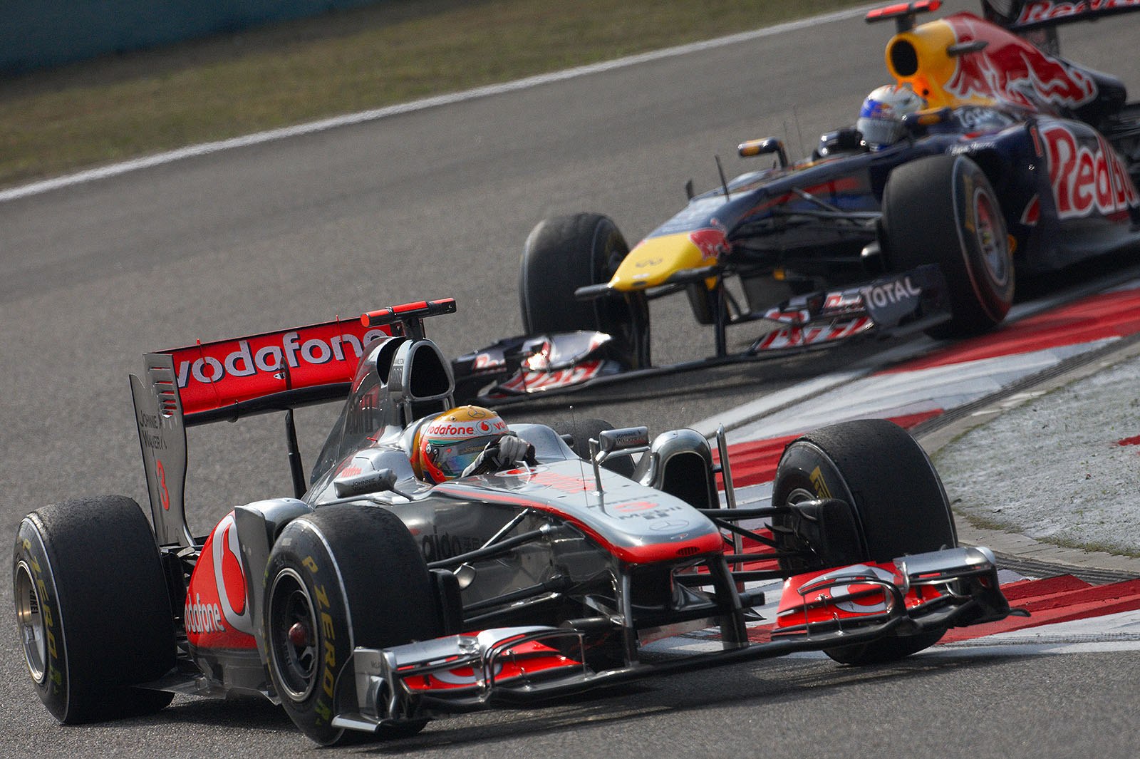 Lewis Hamilton of McLaren Mercedes leads haunter Vettel