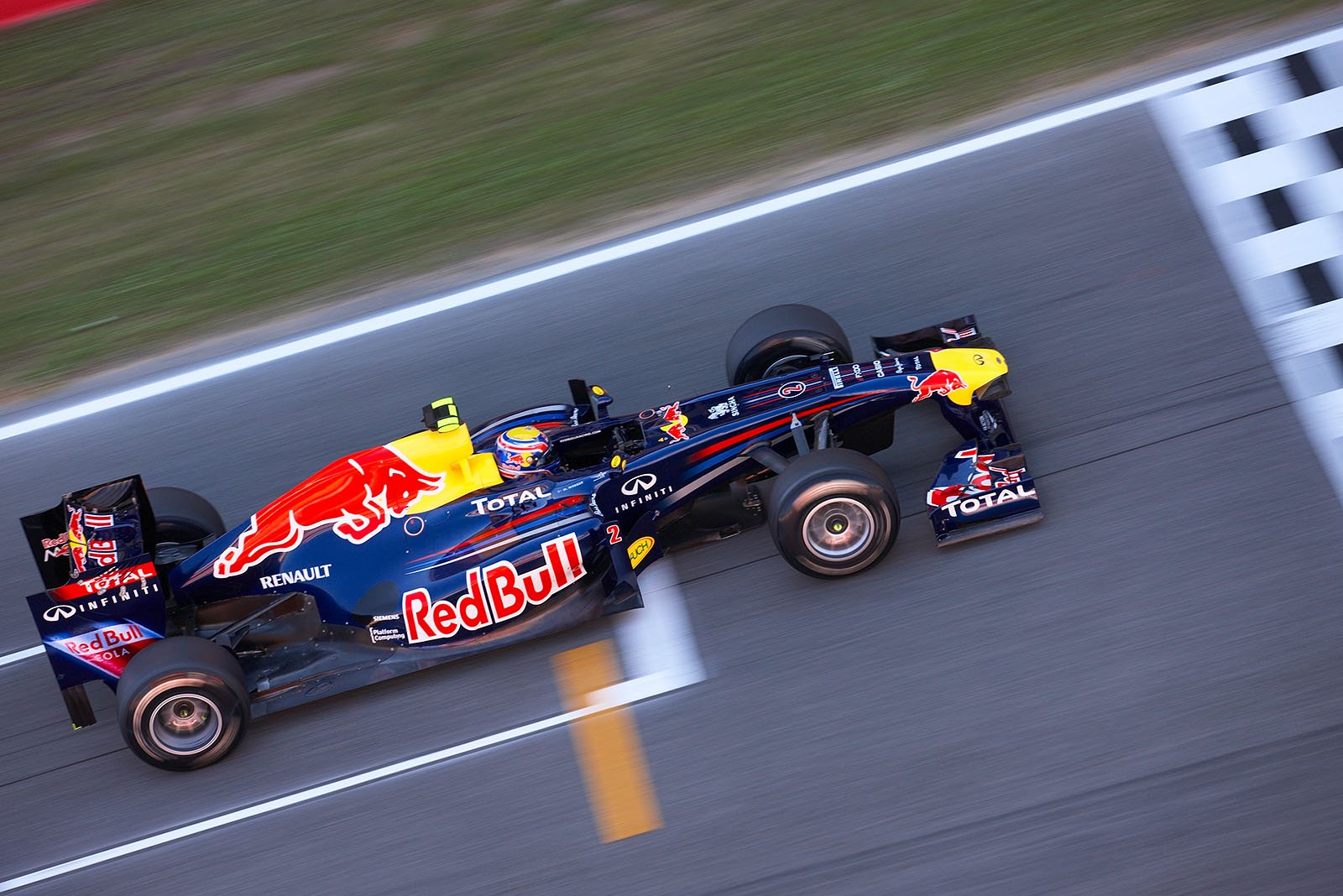 Mark Webber, Red Bull-Renault on start/finish straight.