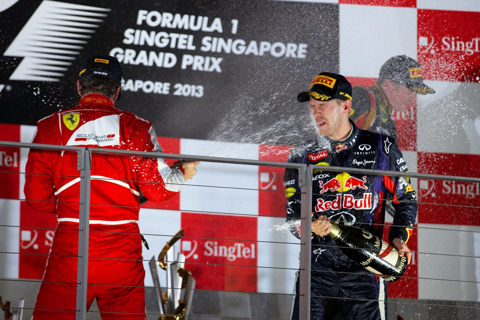 A champagne shower for winner Sebastian Vettel and second-placed Fernando Alonso