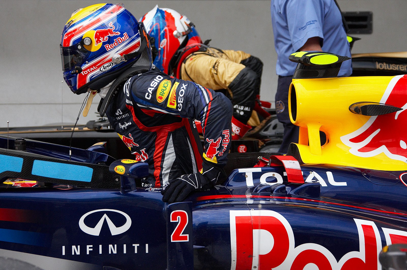 Third grid positioned Mark Webber gets out of the Red Bull-Renault car besides Renault's Petrov after Q3