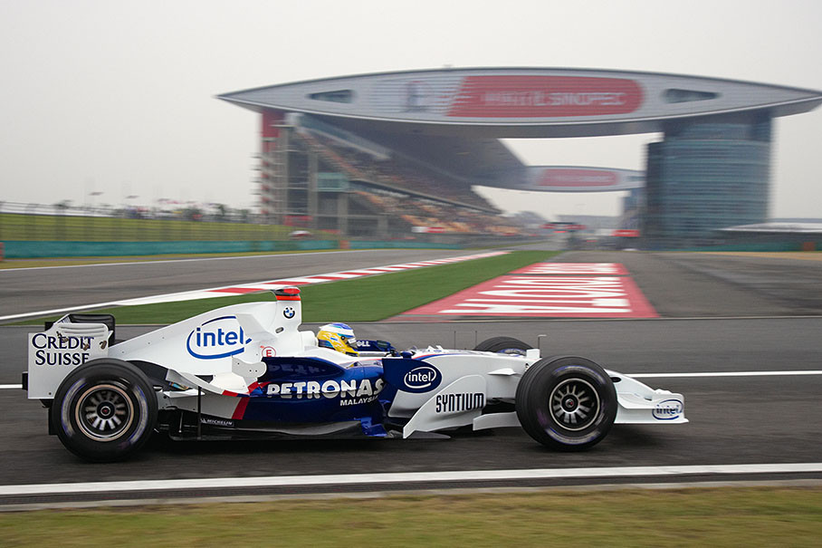 Nick Heidfeld approaching the impressive circuit building