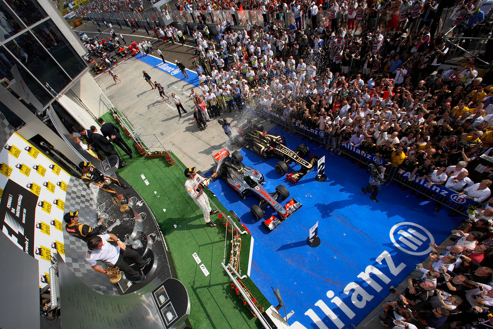 Race winner Lewis Hamilton of McLaren sprays champagne on the podium after the Hungarian Grand Prix