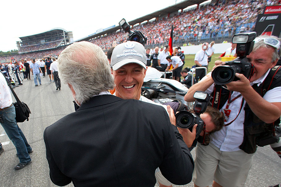 Michael Schumacher, Mercedes GP, receives hugs and kisses from his former manager Willi Weber on the grid
