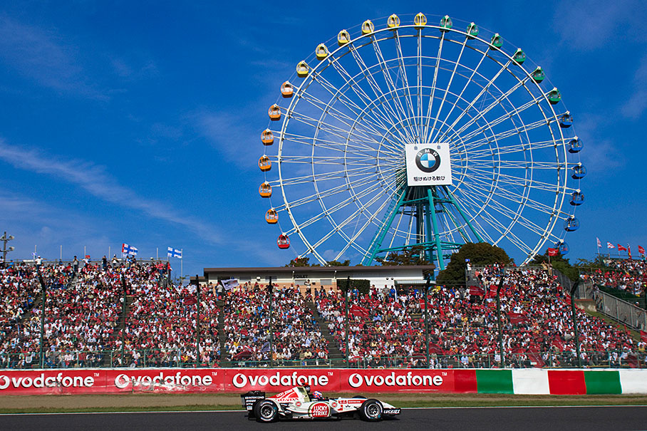 Jenson Button passing the giant wheel.
