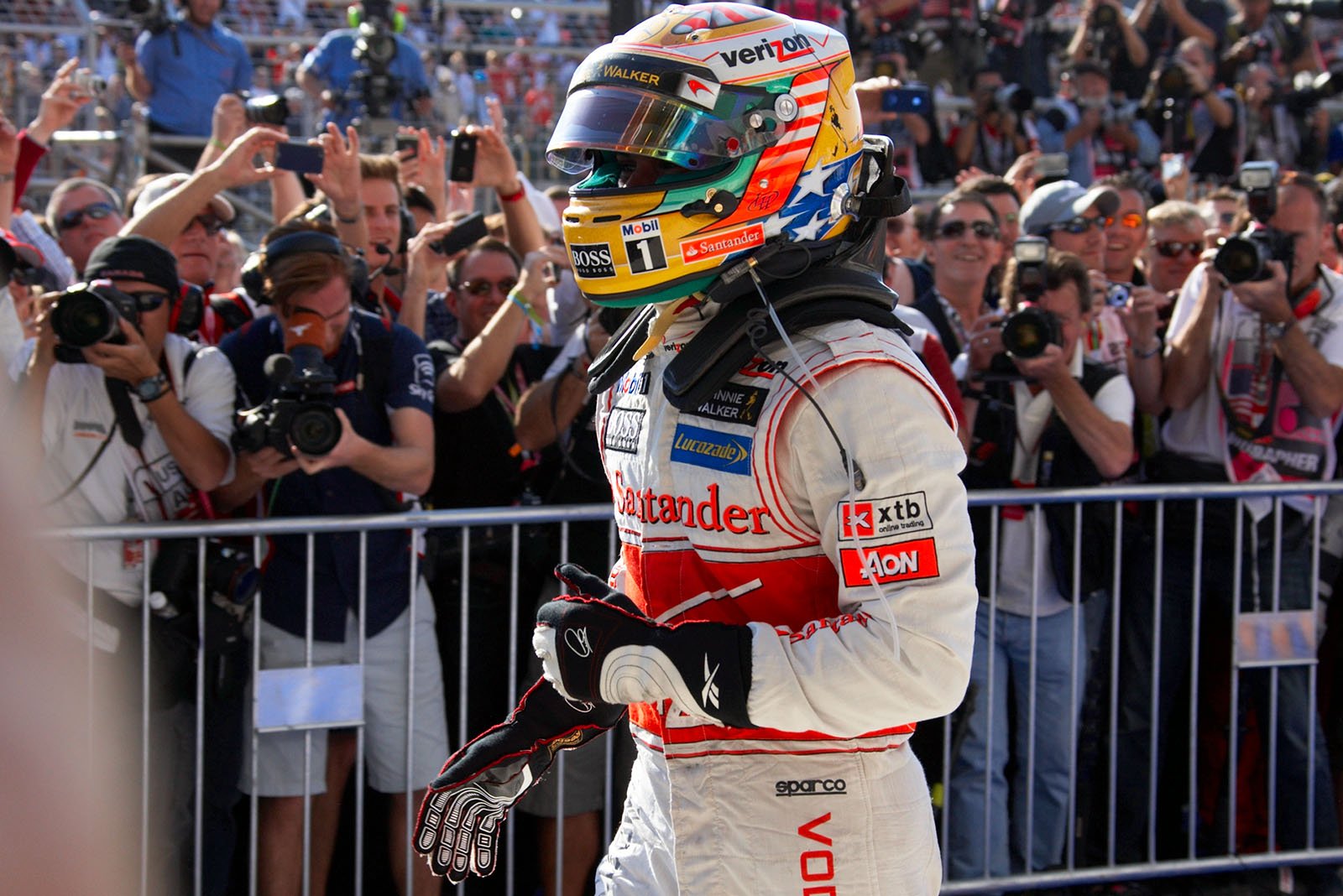 Race winner Lewis Hamilton of McLaren celebrates his achievement in parc ferme