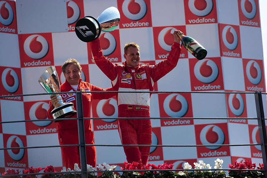 Entirely happy Michael Schumacher and his boss Jean Todt celebrating another victory