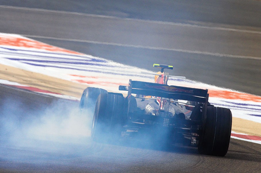 Mark Webber in a cloud of rubber smoke