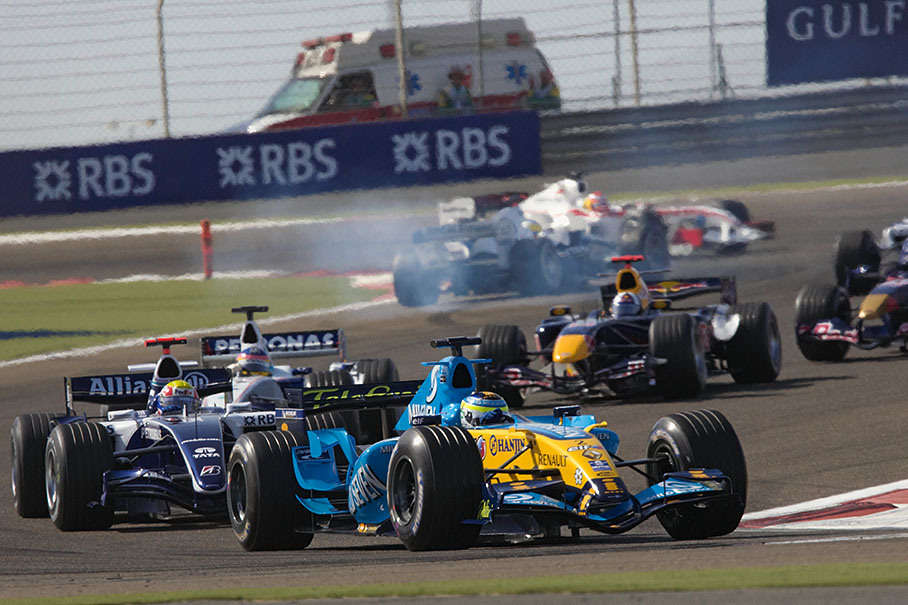 The "first of the last" group, note the wrong way driver (Nick Heidfeld, BMW Sauber) in the background