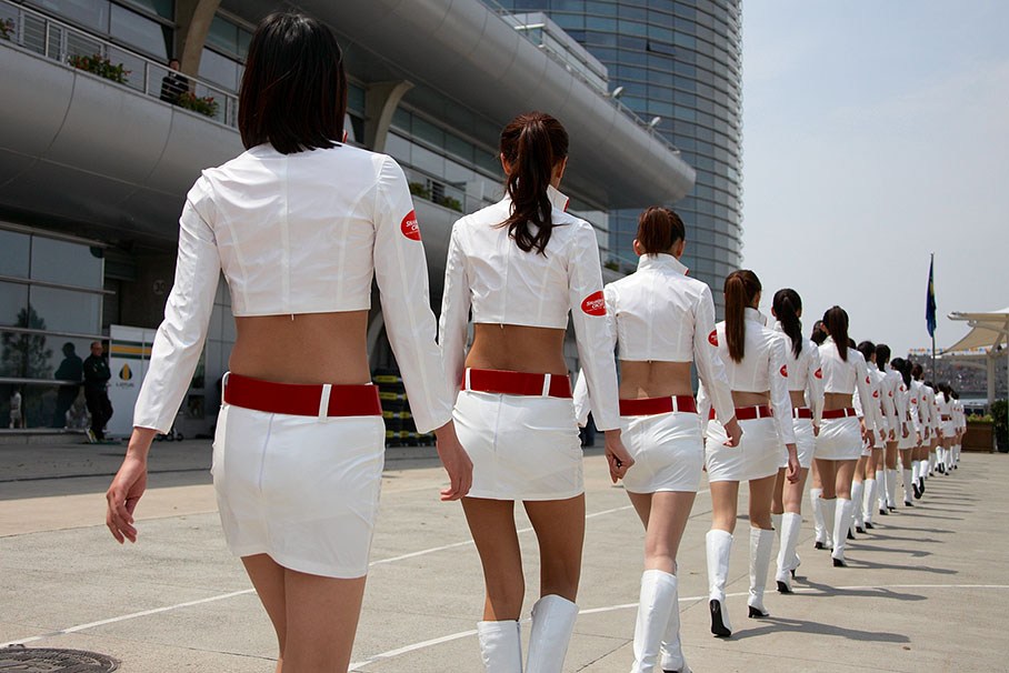 The Chinese grid girls walk in line to drivers parade