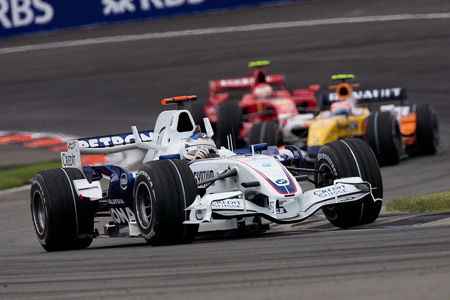 BMW Sauber's Nick Heidfeld, the two Finns Kovalainen and Raikkonen fight in the background