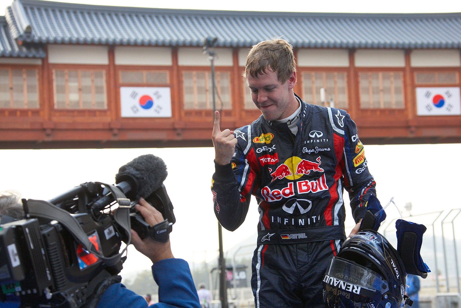 Sebastian Vettel, Red Bull Racing, celebrates on his car in parc ferme after winning the Korean GP