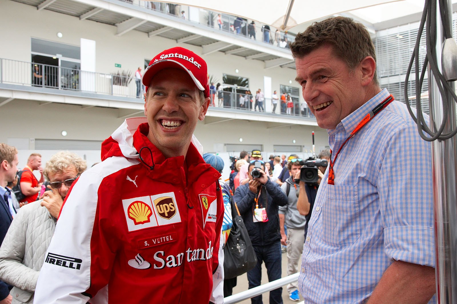 Sebastian Vettel and Thomas Ueberall, international motorsports chief for Red Bull in paddock, Mexican Grand Prix, 2015