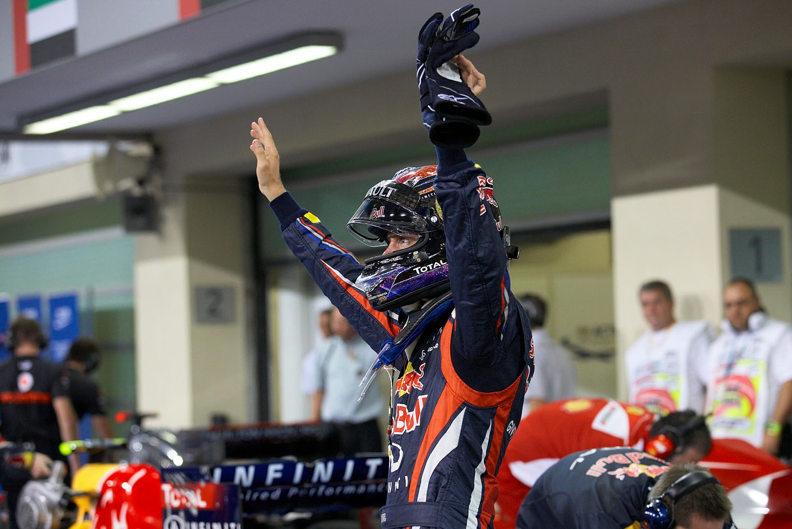 Polesetter Sebastian Vettel of Red Bull Racing celebrates in parc ferme after qualifying