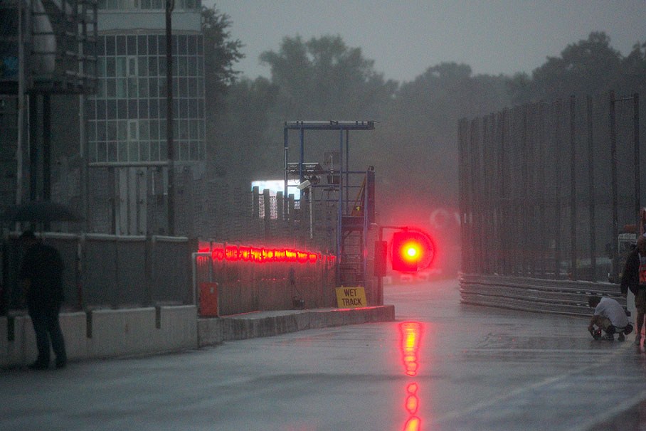 Red lights indicate stopped practice due to weather conditions 'raining cats and dogs'