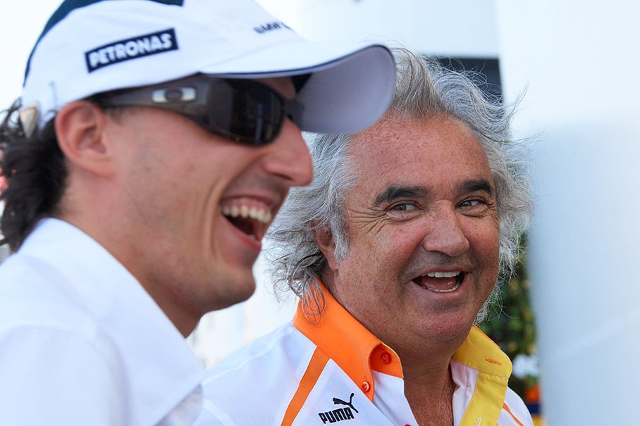 Renault F1 team boss Flavio Briatore jokes around with BMW Sauber's Robert Kubica