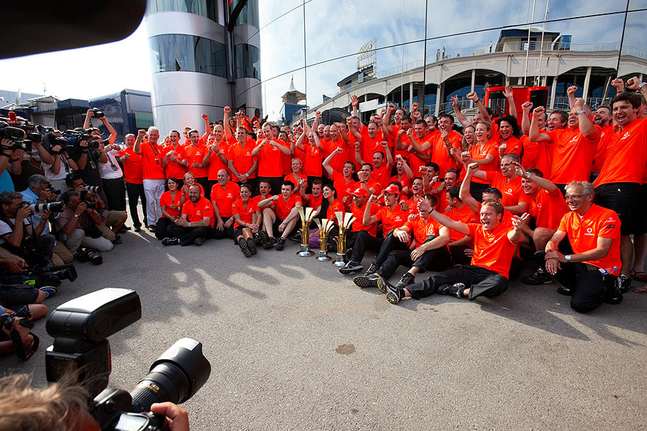 The McLaren team celebrates the one-two victory after the Turkish GP in front of the glossy motorhome