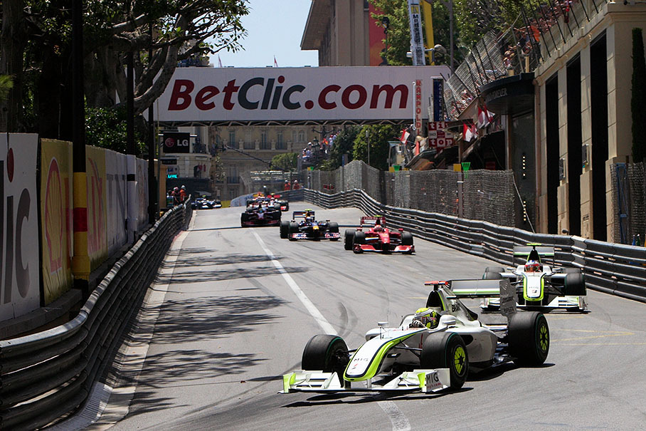 The extended start field at Mirabeau turn with both Brawn GP Mercedes in the lead, Button and Barrichello already with a gap in front of Raikkonen and Vettel